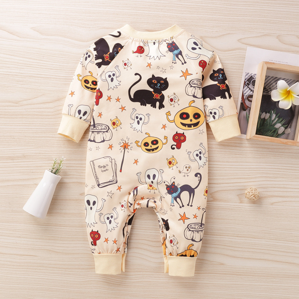 Spooky and Adorable: Dress Your Little One in Our Halloween Print Baby Jumpsuit