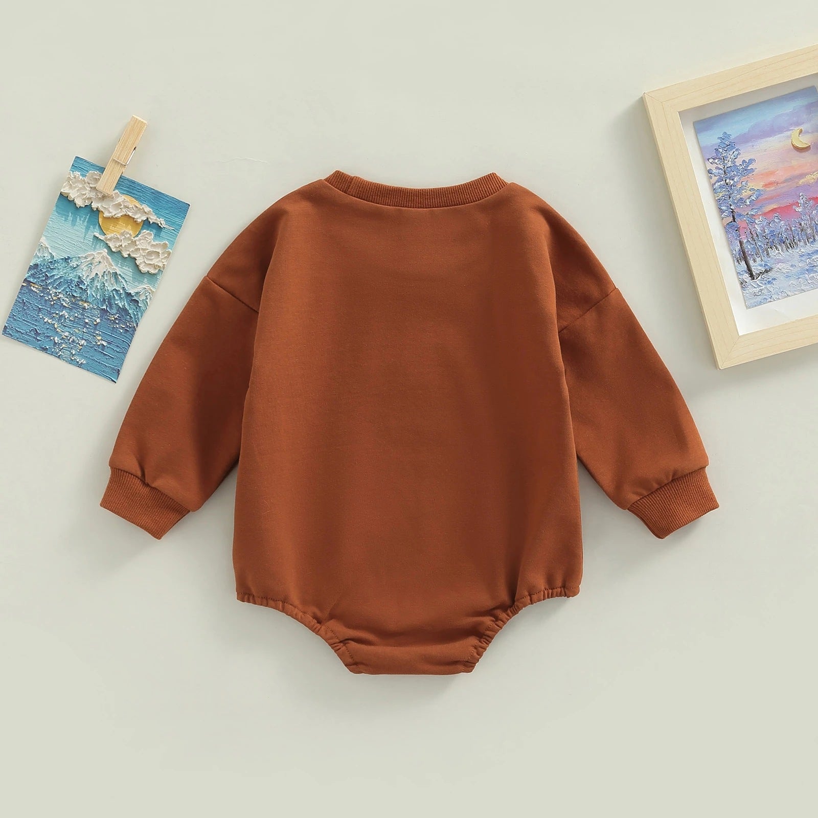 Add Style and Comfort to Your Child's Wardrobe with Our Brown Lettering Printed Romper