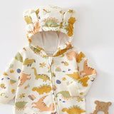 Close-up of the cream dinosaur romper's hood with two bear ears and the top of the zip
