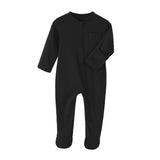 Black cotton baby romper with covered feet and a zip from the neck down one leg, laid flat