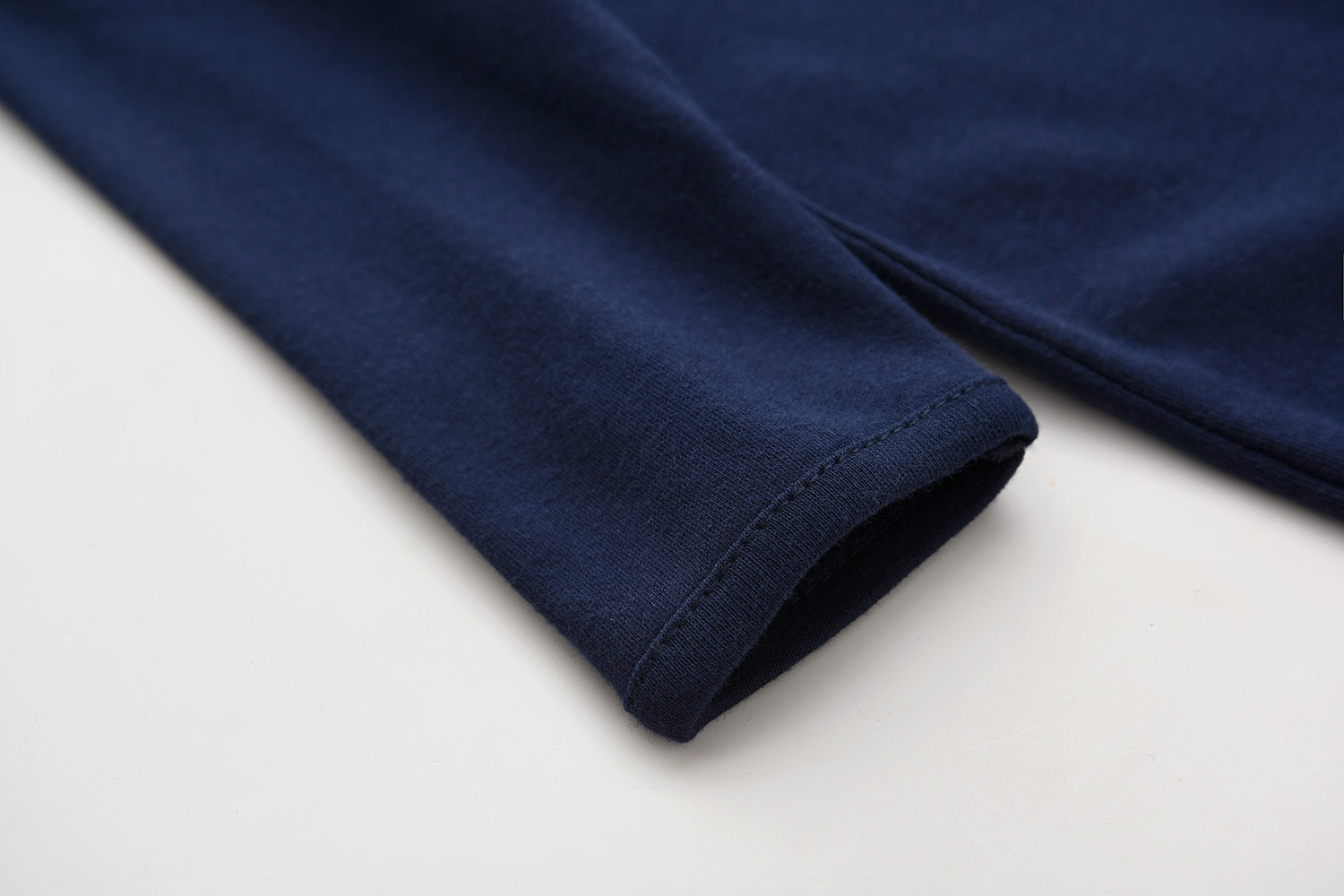 Close-up of the sleeve cuff on the navy romper