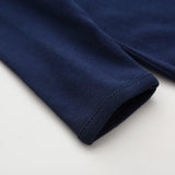 Close-up of the sleeve cuff on the navy romper
