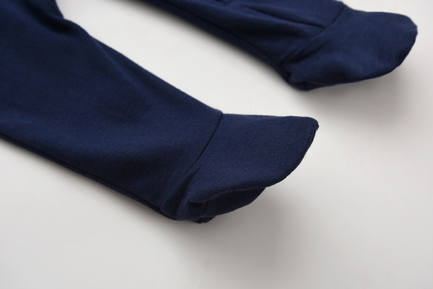 Close-up of the covered feet on the navy romper