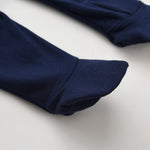 Close-up of the covered feet on the navy romper