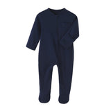 Navy cotton baby romper with covered feet and a zip from the neck down one leg, laid flat