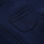Close-up of the chest patch pocket and the zip on the navy romper