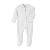 White cotton baby romper with covered feet and a zip from the neck down one leg, laid flat