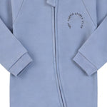 Close-up of the blue sports club print, the cotton jersey and the zip