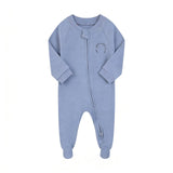 Blue sports club zip baby sleepsuit with covered feet and a tab over the zip, laid flat