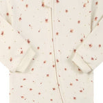 Close-up of the cream ditsy flower print, the cotton jersey and the zip