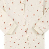Close-up of the cream ditsy flower print, the cotton jersey and the zip