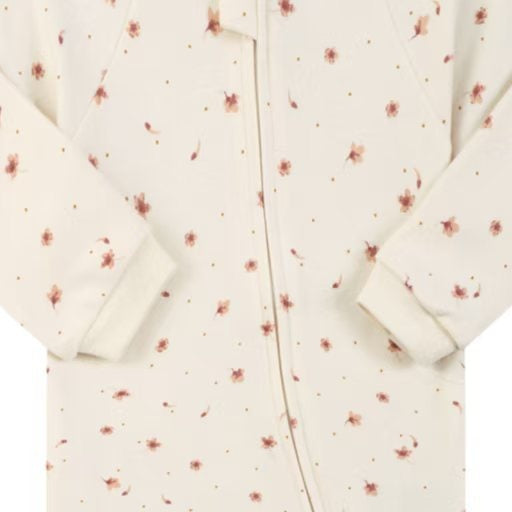 Close-up of the cream ditsy flower print, the cotton jersey and the zip