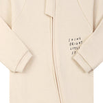 Close-up of the cream little star print, the cotton jersey and the zip