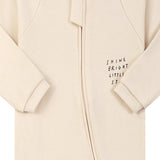Close-up of the cream little star print, the cotton jersey and the zip