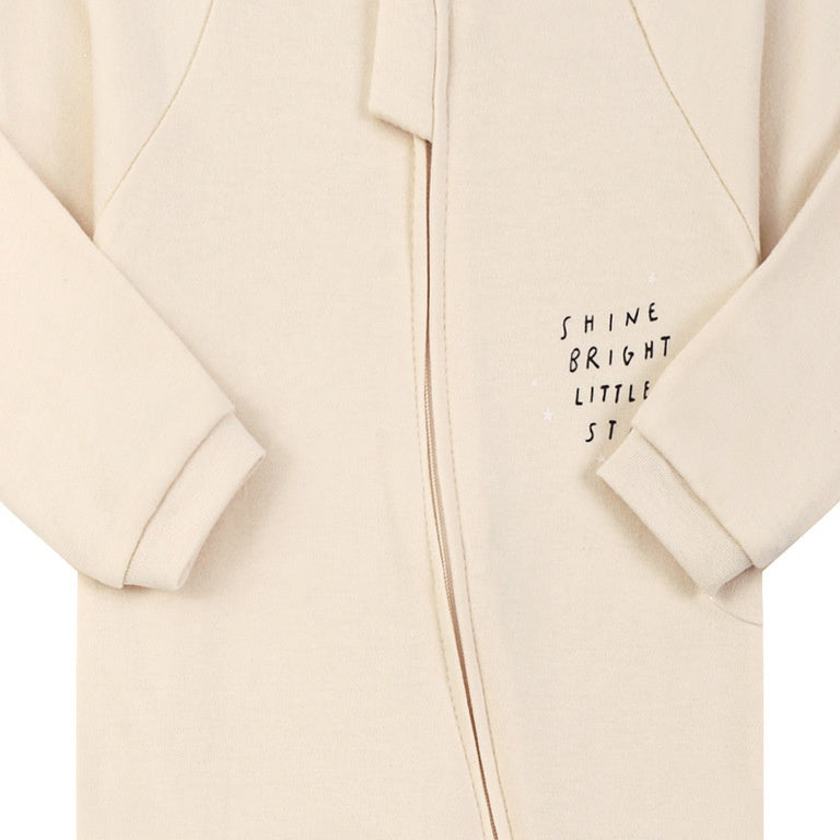 Close-up of the cream little star print, the cotton jersey and the zip
