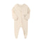 Cream little star zip baby sleepsuit with covered feet and a tab over the zip, laid flat