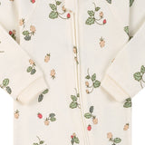 Close-up of the cream wild strawberry print, the cotton jersey and the zip