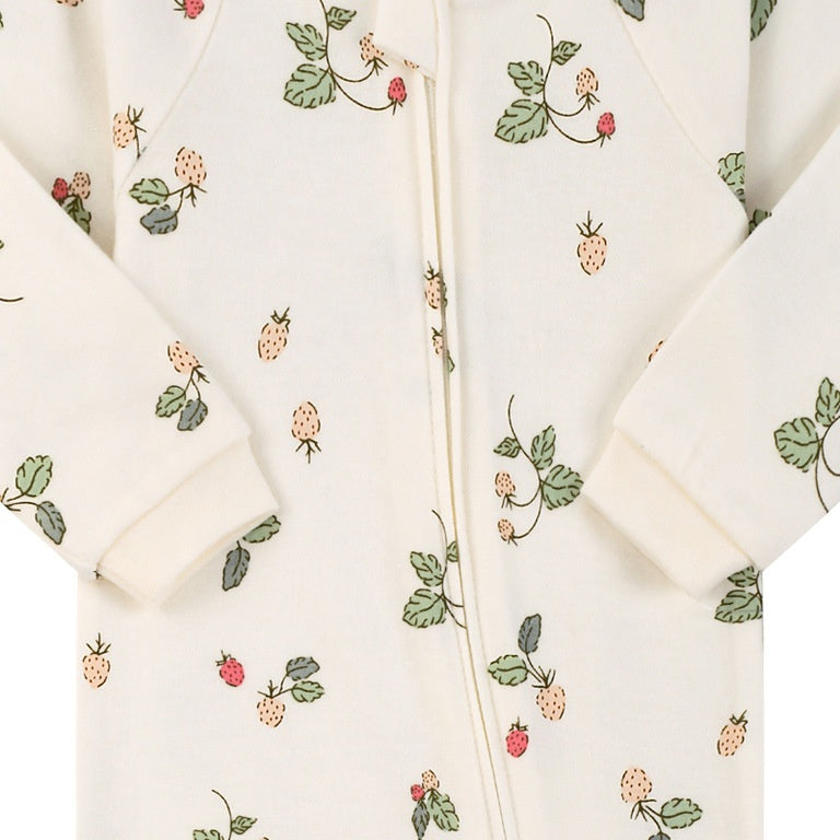 Close-up of the cream wild strawberry print, the cotton jersey and the zip
