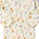 Close-up of the cream wildflower print, the cotton jersey and the zip