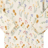 Close-up of the cream wildflower print, the cotton jersey and the zip