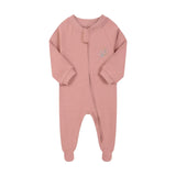 Dusty rose flower zip baby sleepsuit with covered feet and a tab over the zip, laid flat