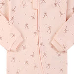 Close-up of the pink bow print, the cotton jersey and the zip