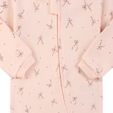 Close-up of the pink bow print, the cotton jersey and the zip