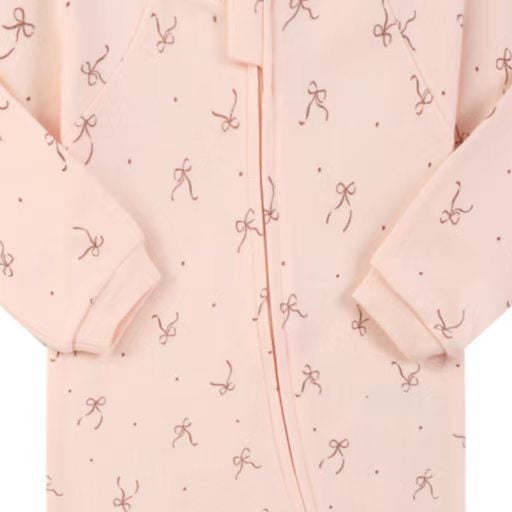 Close-up of the pink bow print, the cotton jersey and the zip