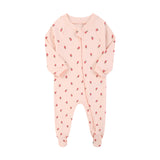 Pink strawberry zip baby sleepsuit with covered feet and a tab over the zip, laid flat