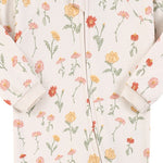 Close-up of the white garden flower print, the cotton jersey and the zip