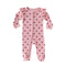 Pink Hearts baby romper with frilled shoulders and a two-way zip from the neck down one leg, laid flat, front view