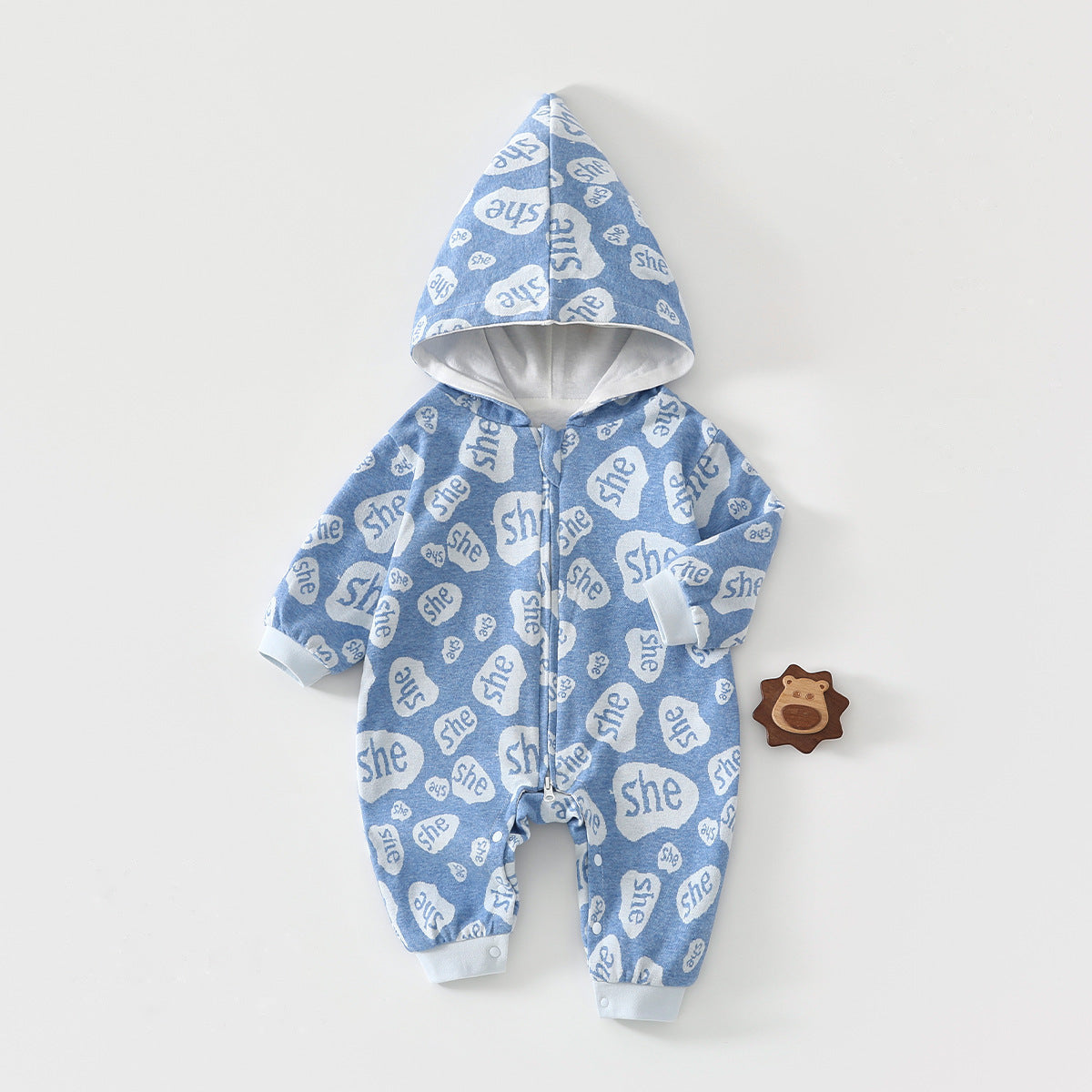 Blue speech bubble hooded baby romper with a zip, laid flat, front view