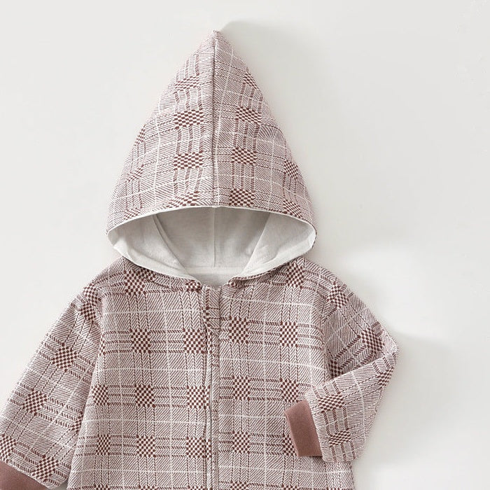 Close-up of the rose check romper's lined pointed hood and the top of the zip