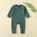 Dark Green ribbed baby romper with a zip from the neck to one ankle and fold-over cuffs, laid flat