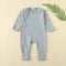 Grey Blue ribbed baby romper with a zip from the neck to one ankle and fold-over cuffs, laid flat