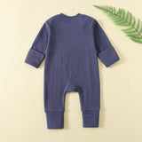 Back of the navy ribbed romper, laid flat, with both hand cuffs folded over