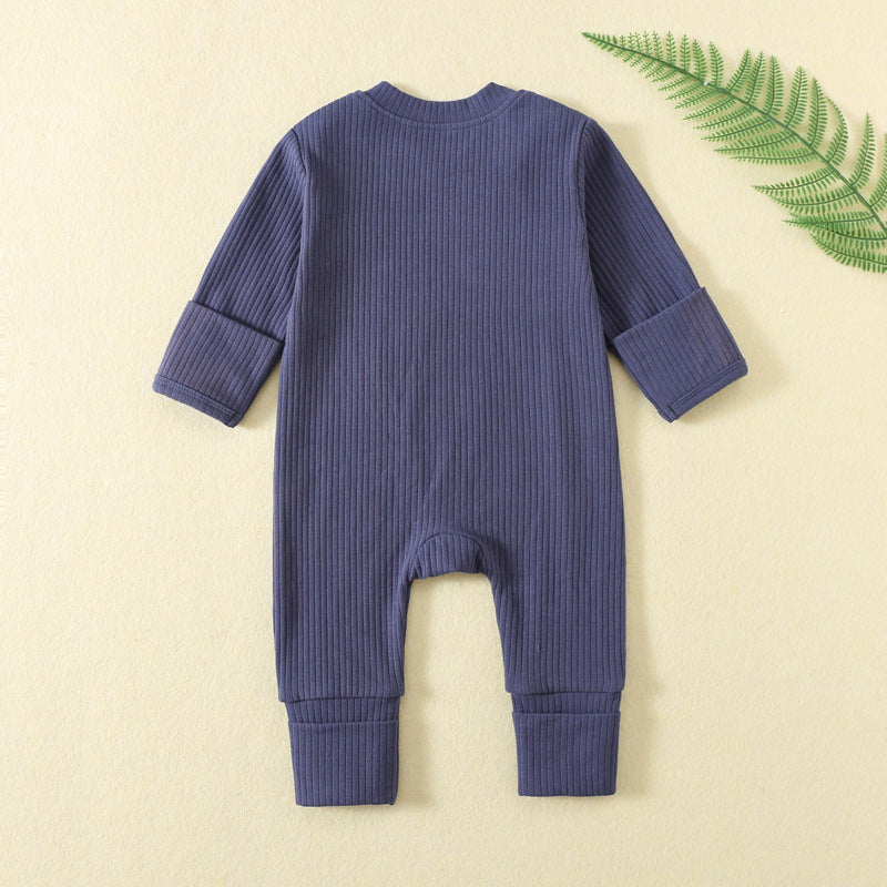 Back of the navy ribbed romper, laid flat, with both hand cuffs folded over