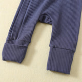 Close-up of the ankle cuffs: one turned up, one folded down to cover the foot