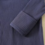 Close-up of the sleeve cuff folded over to cover the hand