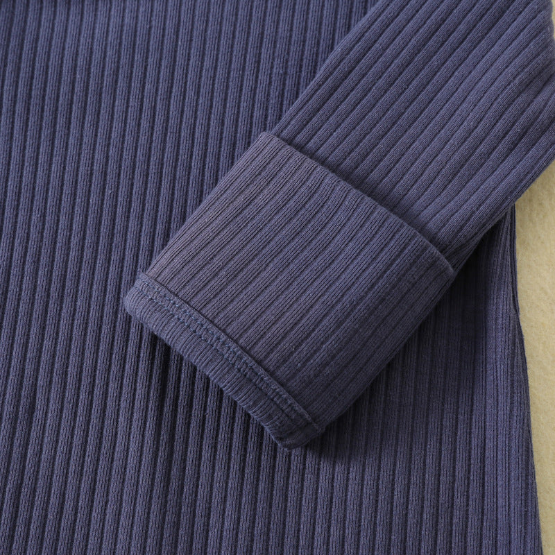 Close-up of the sleeve cuff folded over to cover the hand