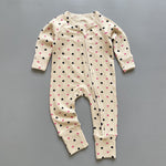 Cream pink heart ribbed zip baby sleepsuit with fold-over hand and foot cuffs, laid flat