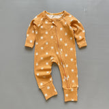 Orange bunny ribbed zip baby sleepsuit with fold-over hand and foot cuffs, laid flat
