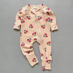 Peach cherry ribbed zip baby sleepsuit with fold-over hand and foot cuffs, laid flat