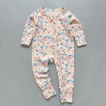 Pink floral ribbed zip baby sleepsuit with fold-over hand and foot cuffs, laid flat