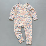 Pink floral ribbed zip baby sleepsuit with fold-over hand and foot cuffs, laid flat