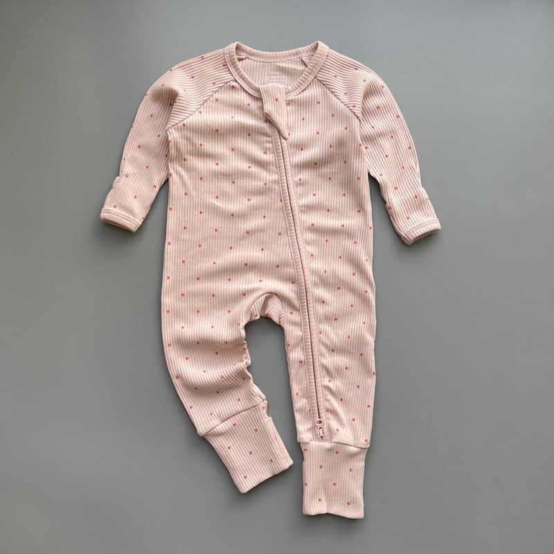 Pink red spot ribbed zip baby sleepsuit with fold-over hand and foot cuffs, laid flat
