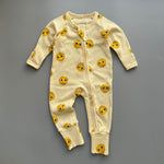 Yellow sunshine ribbed zip baby sleepsuit with fold-over hand and foot cuffs, laid flat