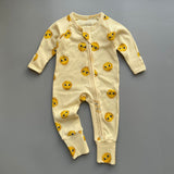 Yellow sunshine ribbed zip baby sleepsuit with fold-over hand and foot cuffs, laid flat