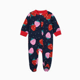 Navy strawberry zip baby sleepsuit with covered feet and a tab at the neck, laid flat
