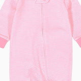 Close-up of the pale pink stripe print, the cotton jersey and the zip